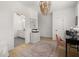 Well-lit office space with stylish lighting and a view into the bathroom at 8240 Sonata Ln, Cumming, GA 30041