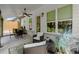 Charming covered patio featuring comfortable seating, a dining set, and serene views of the landscaped backyard at 8240 Sonata Ln, Cumming, GA 30041