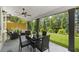 Inviting covered patio with comfortable seating and dining area, perfect for outdoor entertaining at 8240 Sonata Ln, Cumming, GA 30041