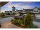Scenic street view showcasing new townhomes with attractive landscaping, curb appeal, and convenient parking at 8240 Sonata Ln, Cumming, GA 30041