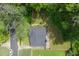 This aerial view shows the backyard's mature trees, well-manicured lawn, and desirable location at 184 Rambo Sw Pl, Marietta, GA 30064