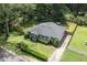 Aerial view of the property showcasing its well-manicured lawn, mature trees, and desirable location at 184 Rambo Sw Pl, Marietta, GA 30064