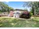 This backyard shows a home with a brick chimney, an outdoor storage, and is perfect for entertaining at 184 Rambo Sw Pl, Marietta, GA 30064
