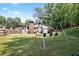 Spacious backyard featuring a home with a brick chimney and a swing set for outdoor enjoyment at 184 Rambo Sw Pl, Marietta, GA 30064