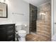 This bathroom features a tile shower with glass doors and a dark wood vanity at 184 Rambo Sw Pl, Marietta, GA 30064