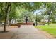 Picturesque city park with paved walkways, lush greenery, a decorative fountain, and benches for community enjoyment at 184 Rambo Sw Pl, Marietta, GA 30064