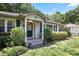 Inviting home featuring a charming entrance framed by lush greenery and manicured landscaping at 184 Rambo Sw Pl, Marietta, GA 30064