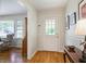 Welcoming foyer showcasing gleaming hardwood floors and a charming entry door with sidelights at 184 Rambo Sw Pl, Marietta, GA 30064