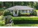 Charming single-story home with a well-manicured lawn, mature trees, and inviting curb appeal at 184 Rambo Sw Pl, Marietta, GA 30064