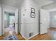 Bright foyer leads to a dining room featuring wood floors and neutral color palette at 184 Rambo Sw Pl, Marietta, GA 30064