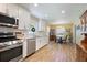 Open kitchen view highlighting stainless steel appliances, granite counters, and an adjacent dining area at 184 Rambo Sw Pl, Marietta, GA 30064