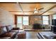 Living room showcasing a brick fireplace, wood paneling, and comfortable seating area at 184 Rambo Sw Pl, Marietta, GA 30064