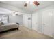 Large main bedroom with carpet floors, light gray walls, and windows with patterned curtains at 184 Rambo Sw Pl, Marietta, GA 30064