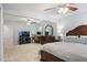 Spacious main bedroom featuring a ceiling fan, carpet floors, and a work space at 184 Rambo Sw Pl, Marietta, GA 30064