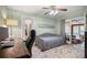 Home office featuring a daybed, desk, and access to the sunroom with a comfortable seating area at 184 Rambo Sw Pl, Marietta, GA 30064