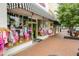 Charming storefront featuring a colorful awning, inviting display windows, and a welcoming atmosphere for shopping at 184 Rambo Sw Pl, Marietta, GA 30064
