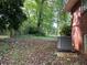 View of the backyard with leaves and trees at 185 W Lake Nw Dr, Atlanta, GA 30314