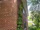 Exterior corner view of brick house with foliage at 185 W Lake Nw Dr, Atlanta, GA 30314