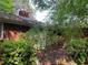 View of the exterior of the house with overgrown bushes and brick facade at 185 W Lake Nw Dr, Atlanta, GA 30314