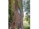 Exterior brick wall with vines growing up the wall at 185 W Lake Nw Dr, Atlanta, GA 30314