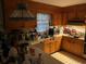 Functional kitchen featuring wood cabinets, tiled floors, and essential appliances, ready for updates at 185 W Lake Nw Dr, Atlanta, GA 30314