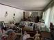View of cluttered living room with white walls and curtains ready for a new design vision at 185 W Lake Nw Dr, Atlanta, GA 30314