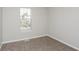 Neutral bedroom with wall-to-wall carpet and a sunny window at 2447 Stancrest Ln, Lawrenceville, GA 30044