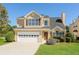 Charming two-story home with a well-manicured lawn and attached two car garage at 2447 Stancrest Ln, Lawrenceville, GA 30044