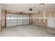 Spacious garage with a multi-panel roll-up door and ample space for storage at 2447 Stancrest Ln, Lawrenceville, GA 30044