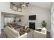 Open-concept living area with fireplace flowing into dining room with a view of the loft at 2447 Stancrest Ln, Lawrenceville, GA 30044