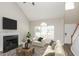 Bright living room with vaulted ceilings, a cozy fireplace, and large windows at 2447 Stancrest Ln, Lawrenceville, GA 30044