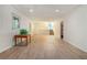 Spacious basement with wood-look flooring, paneled walls, and recessed lighting, perfect for customization at 5170 Oxbow Rd, Stone Mountain, GA 30087
