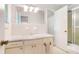 Classic bathroom featuring a single vanity, shower and tub combo, and plenty of storage at 5170 Oxbow Rd, Stone Mountain, GA 30087