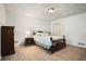 Charming bedroom with wood flooring, large window, and ample closet space, offering comfort and storage at 5170 Oxbow Rd, Stone Mountain, GA 30087