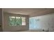 Spacious room with large windows offering backyard views, ready for customization and interior design at 6821 Phillips Mill Rd, Douglasville, GA 30135