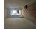 Unfinished interior space with open doorway, visible exterior views, and potential for customization at 6821 Phillips Mill Rd, Douglasville, GA 30135