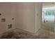 Unfinished room awaiting completion, featuring open access to bright, window-lit area at 6821 Phillips Mill Rd, Douglasville, GA 30135
