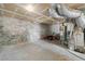 Unfinished basement with block walls houses the furnace and provides ample storage space at 1857 Barrington Ct, Marietta, GA 30066