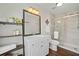 Modern bathroom featuring a shower over bath, floating shelves, and stylish neutral tile at 1857 Barrington Ct, Marietta, GA 30066