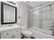 Clean bathroom features a shower over bath and a modern vanity with framed mirror at 1857 Barrington Ct, Marietta, GA 30066