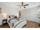 Bedroom featuring hardwood floors, a ceiling fan, and neutral paint, perfect for creating a relaxing haven at 1857 Barrington Ct, Marietta, GA 30066