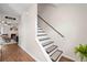 Inviting entryway with a view into the living room, featuring a staircase and wood flooring at 1857 Barrington Ct, Marietta, GA 30066
