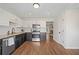 Modern kitchen with stainless steel appliances, granite counters, and wood flooring at 1857 Barrington Ct, Marietta, GA 30066
