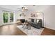 Bright living room features a fireplace, ceiling fan, and French doors to the outside at 1857 Barrington Ct, Marietta, GA 30066