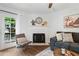 Inviting living area featuring a decorative fireplace, chair, and French doors to the outside at 1857 Barrington Ct, Marietta, GA 30066