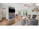 Open-concept living space with designer wall accents, leading to dining area and bathroom at 1857 Barrington Ct, Marietta, GA 30066