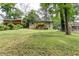 Back exterior of home with a large backyard and a wooden deck at 2131 Glendale Dr, Decatur, GA 30032