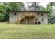 Rear exterior view of home with a spacious backyard and a wooden deck at 2131 Glendale Dr, Decatur, GA 30032