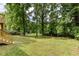A sprawling backyard featuring a wooden deck and a lush lawn at 2131 Glendale Dr, Decatur, GA 30032