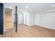Open basement design with modern flooring, white trim, a staircase and multiple closets at 2131 Glendale Dr, Decatur, GA 30032
